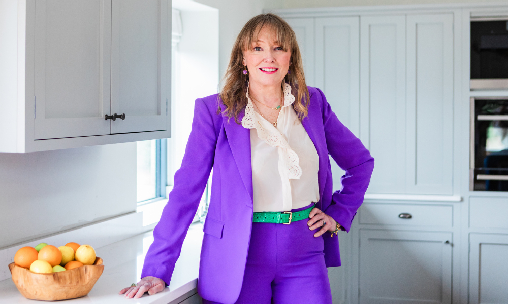 House of Colour stylist Sandy Lancaster in purple suit